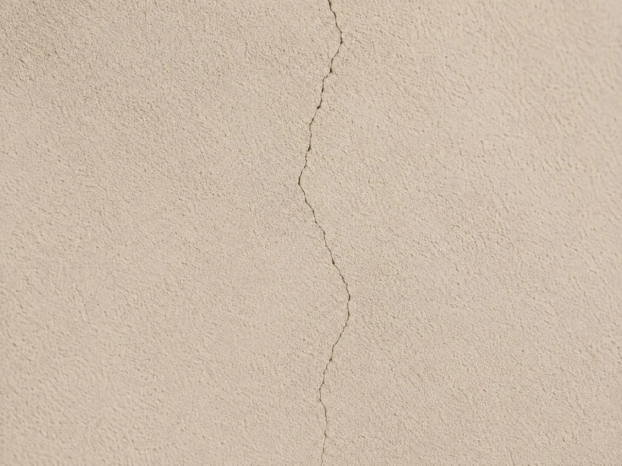 Close-up example of a crack in stucco